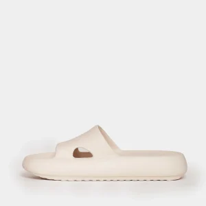 Acquista slipper in gomma color crema da TORY BURCH
